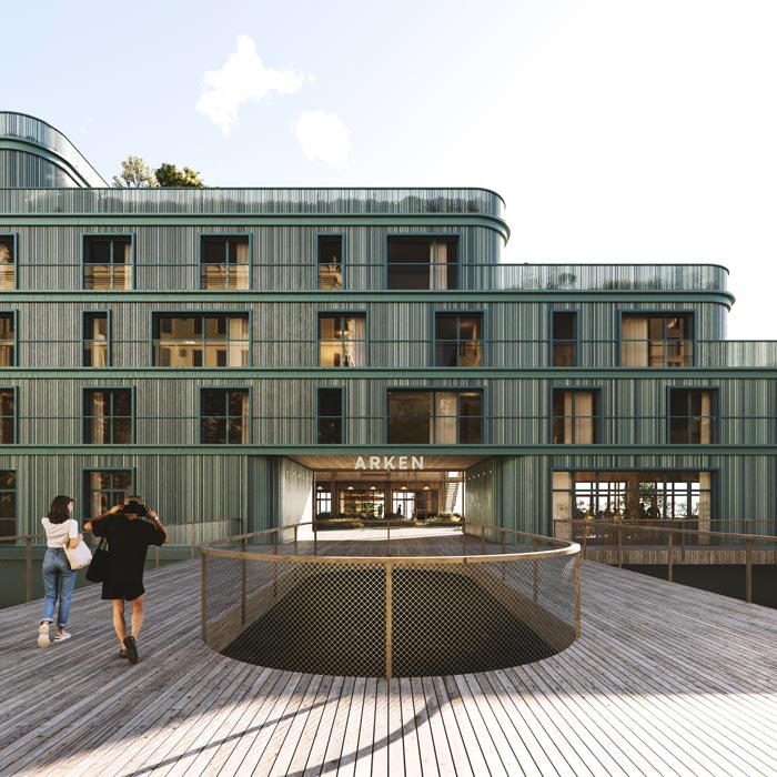 Den breda promenaden som leder in genom portiken och vidare in till entrédäckets gröna landskap med publika funktioner.